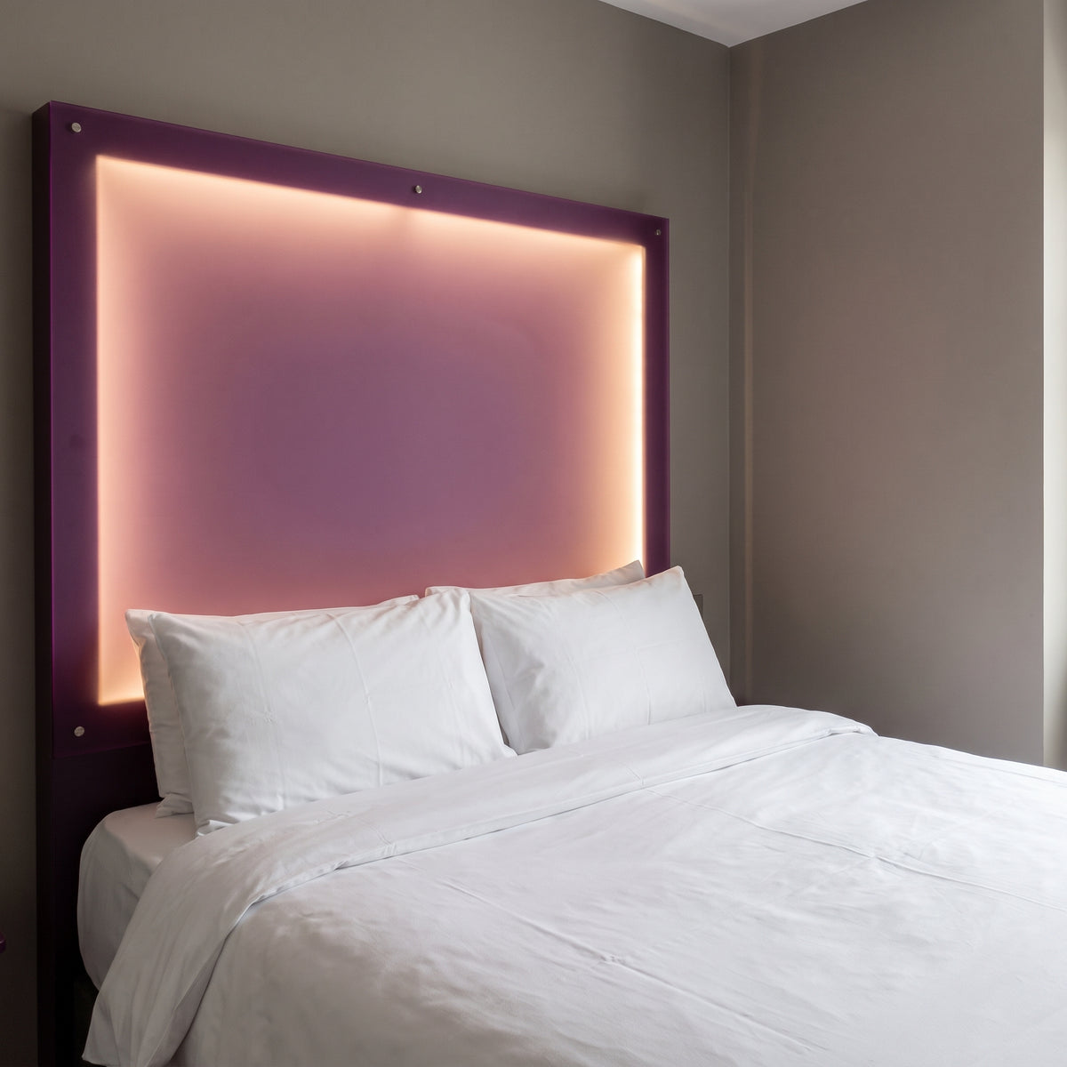 Perfect Plum frosted Perspex acrylic sheet (S2 8T15) used as a back-lit headboard
