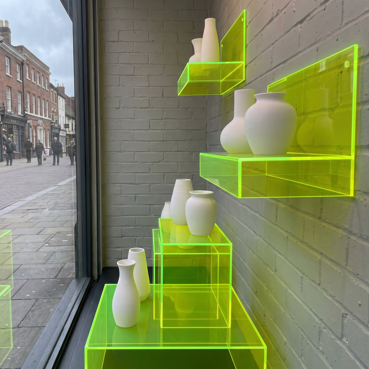 Fluorescent Helios Yellow 2T51 Perspex shelves with glowing edges
