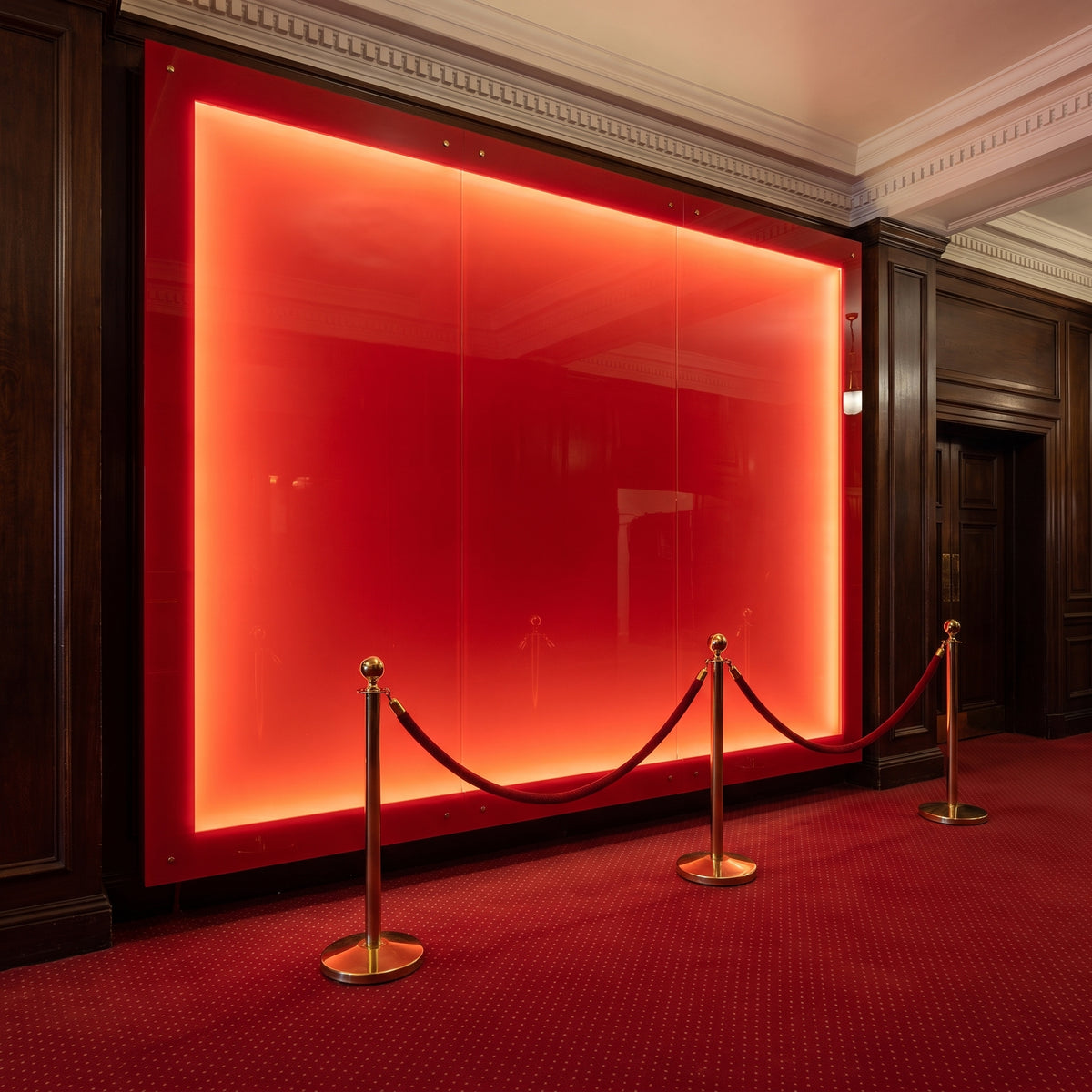 Red 433 back-lit Perspex foyer wall